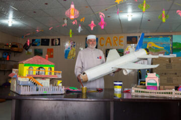 Mohammad, 65, was a farmer in Syria, but is now known as the Toymaker of Azraq camp in Jordan. Image © Justin Bastien/CARE